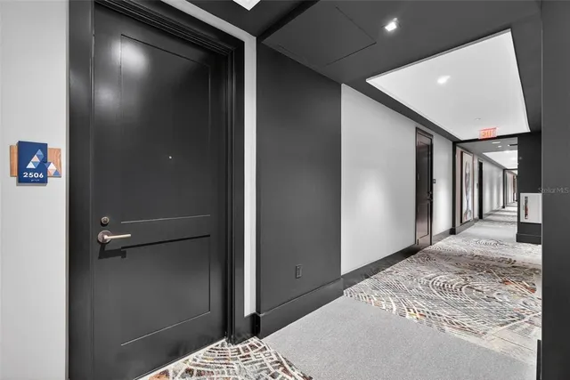 a living room with furniture and a painting