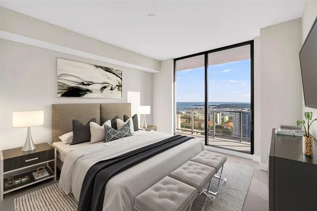 a dinning room with furniture and a flat screen tv