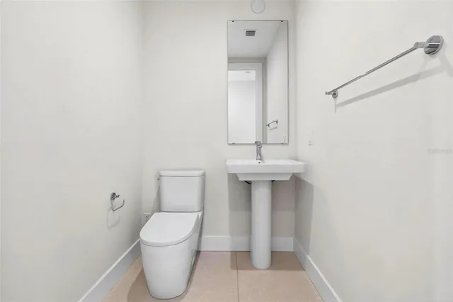 a living room with furniture a rug and a large window