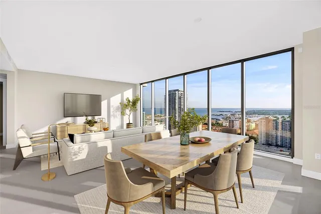 a large white kitchen with a large window