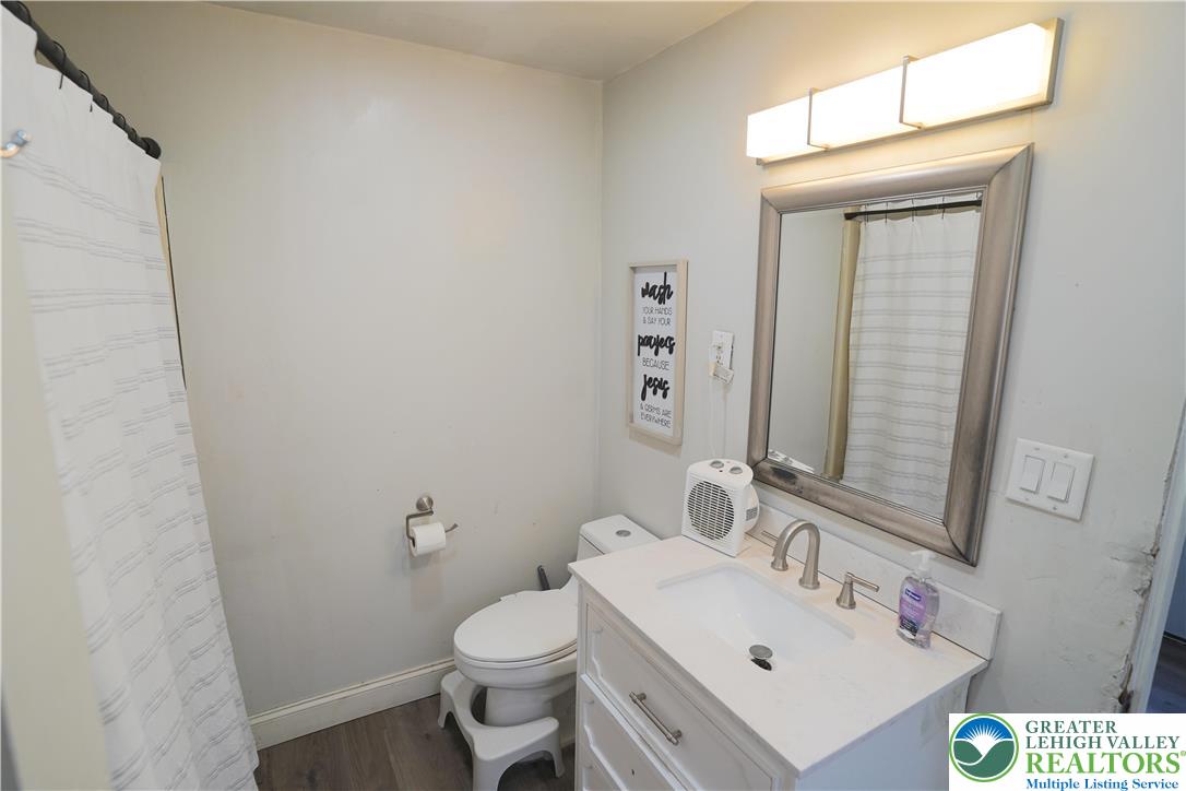 3863 Mauch Chunk Road Coplay, PA 18037 - Photo 13 of 33 a bathroom with a sink and a mirror