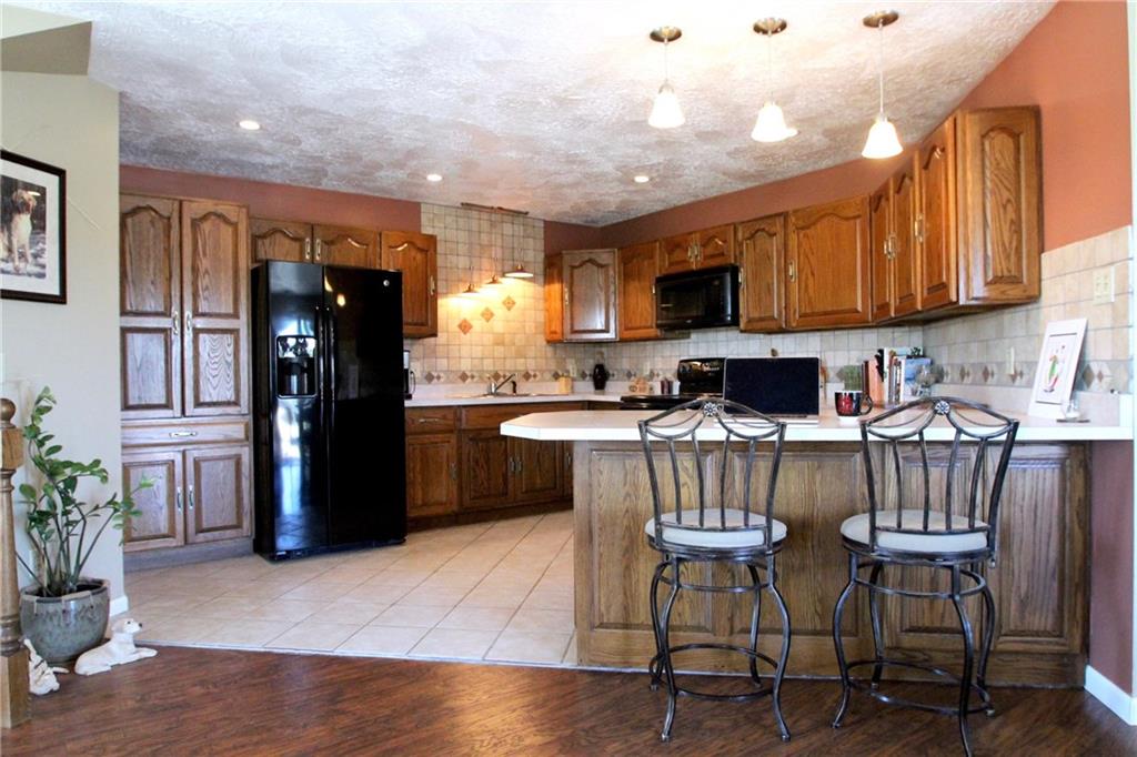 109 Ragan Road Prospect, PA 16052 - Photo 2 of 24 Huge open concept kitchen with handcrafted solid oak cabinetry!