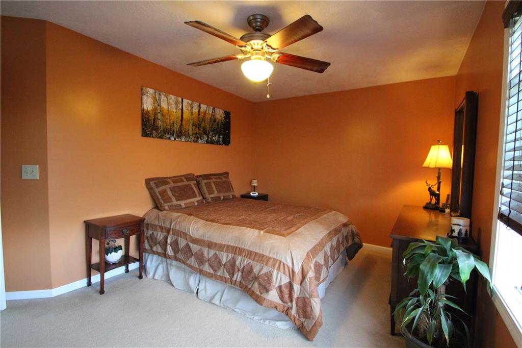 109 Ragan Road Prospect, PA 16052 - Photo 8 of 24 Master bedroom features a soothing warm color scheme and ceiling fan.