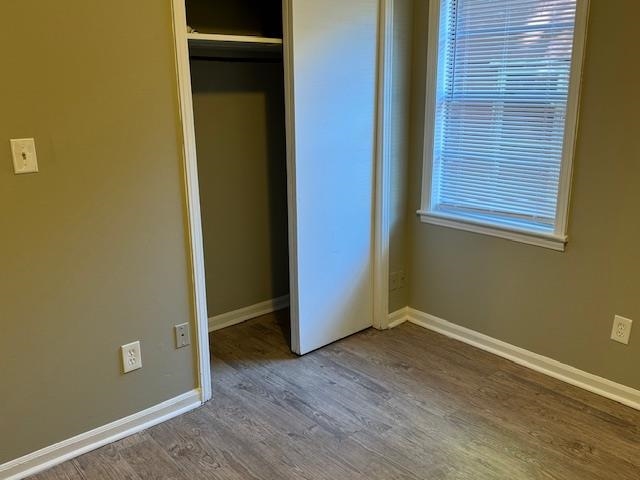 3245 Sinclair Street Memphis, TN 38127 - Photo 13 of 28 Unfurnished bedroom with wood-type flooring and a closet