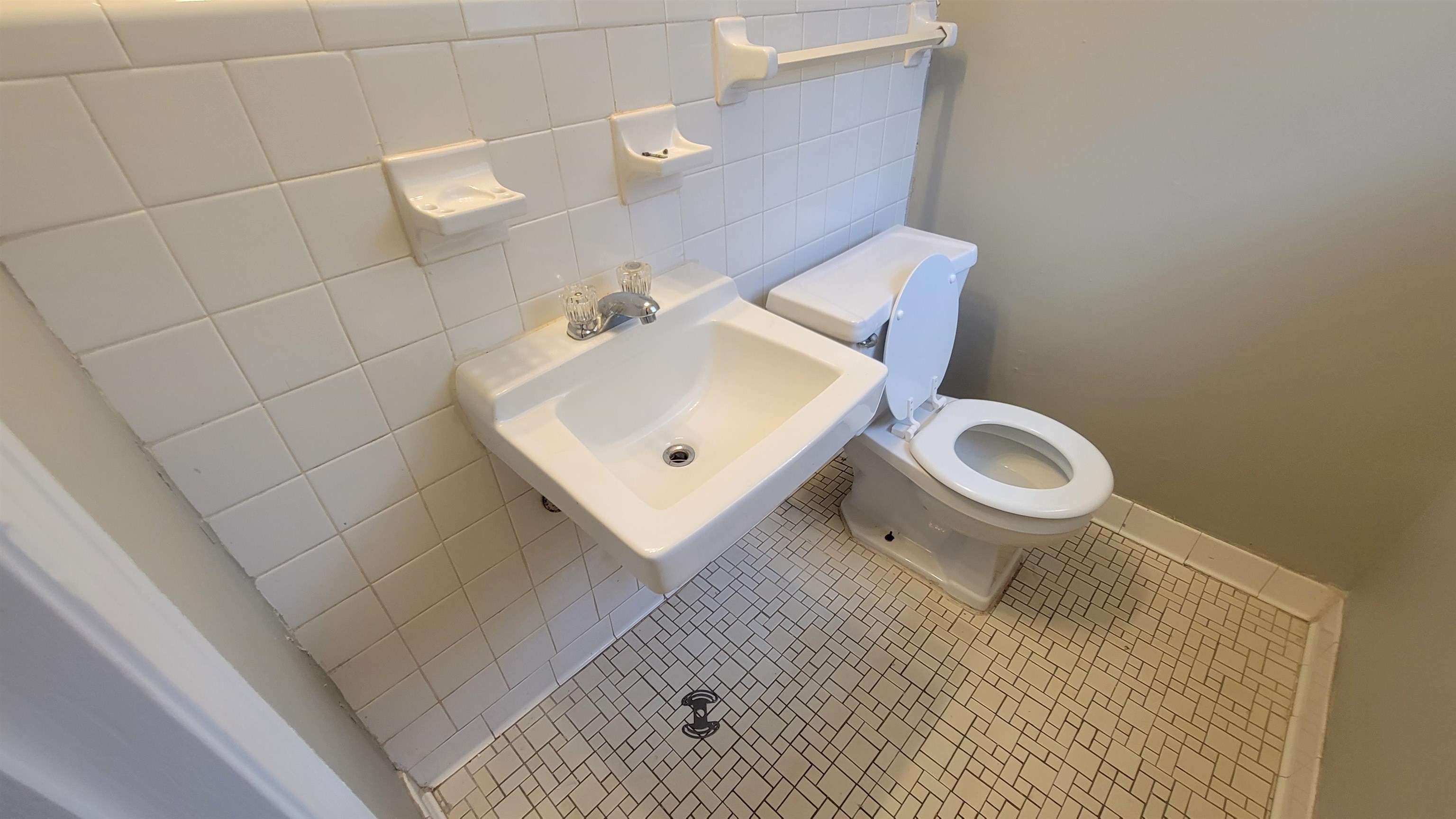 3245 Sinclair Street Memphis, TN 38127 - Photo 16 of 28 Bathroom featuring tile patterned flooring, toilet, tile walls, and sink