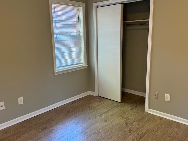 3245 Sinclair Street Memphis, TN 38127 - Photo 19 of 28 Unfurnished bedroom with a closet and hardwood / wood-style floors