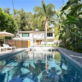 a view of a swimming pool with chairs