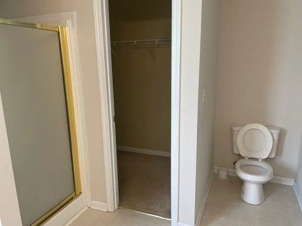 a bathroom with a toilet and a sink