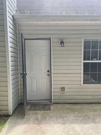 a view of a door and a window