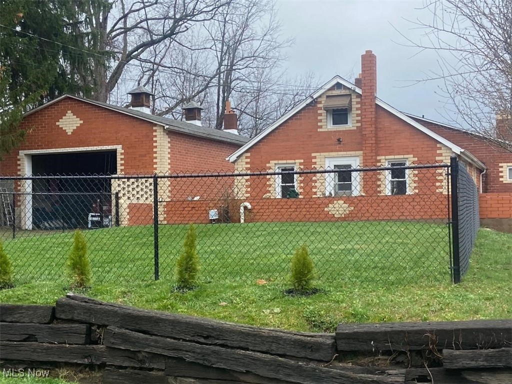 South facing, front view off Cates Rd. Home and large Garage