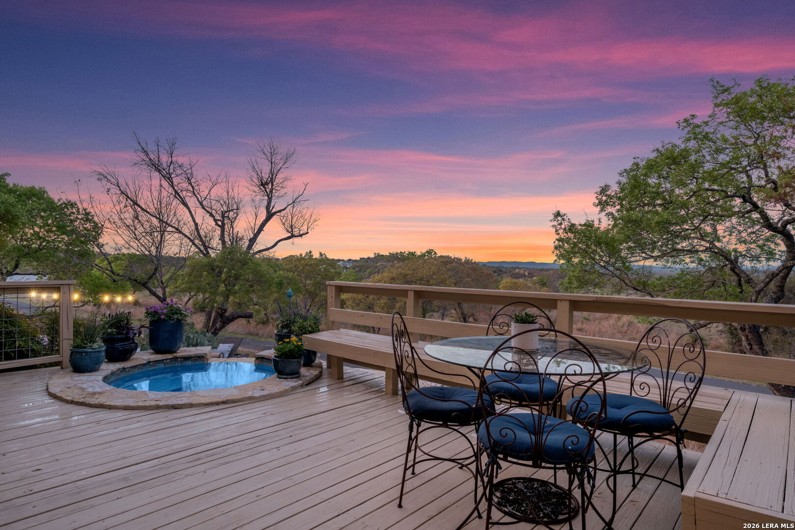 1429 Kendall Jackson Comfort, TX 78013 - Photo 1 of 88 a view of a roof deck with table and chairs with wooden floor and fence
