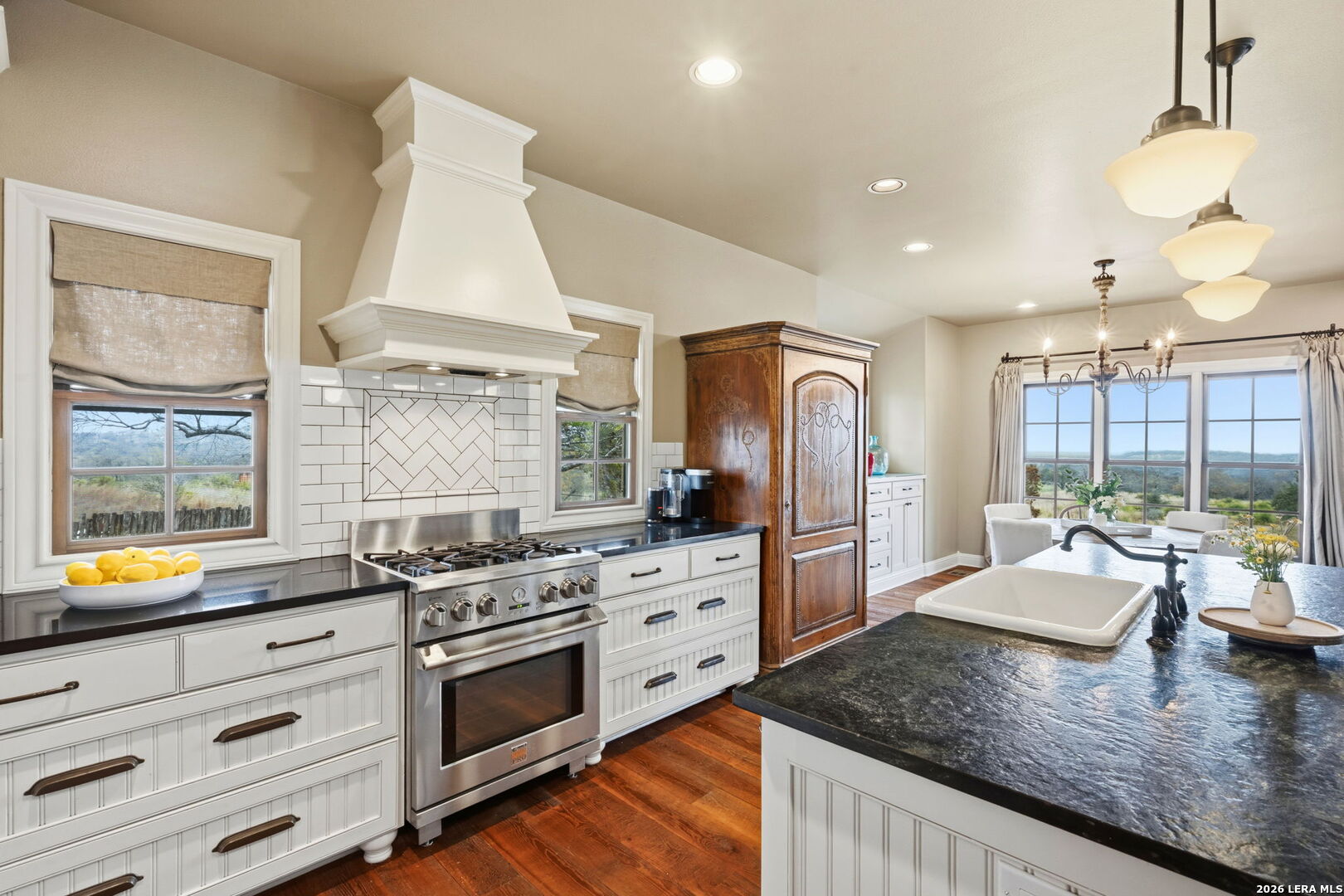 1429 Kendall Jackson Comfort, TX 78013 - Photo 22 of 88 a kitchen with stainless steel appliances granite countertop a stove a sink and a granite counter tops with white cabinets