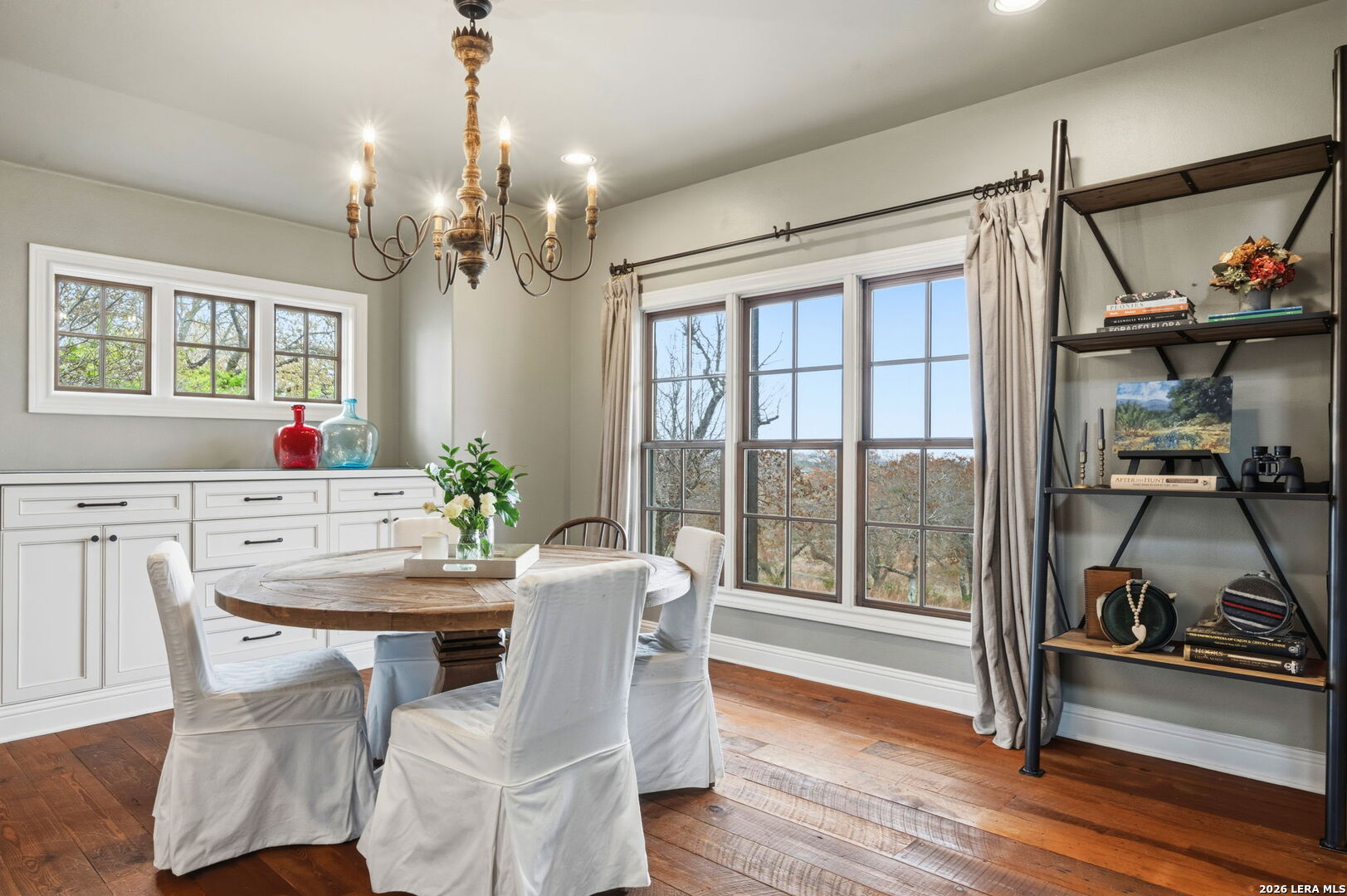 1429 Kendall Jackson Comfort, TX 78013 - Photo 25 of 88 a view of a dining room with furniture window and wooden floor