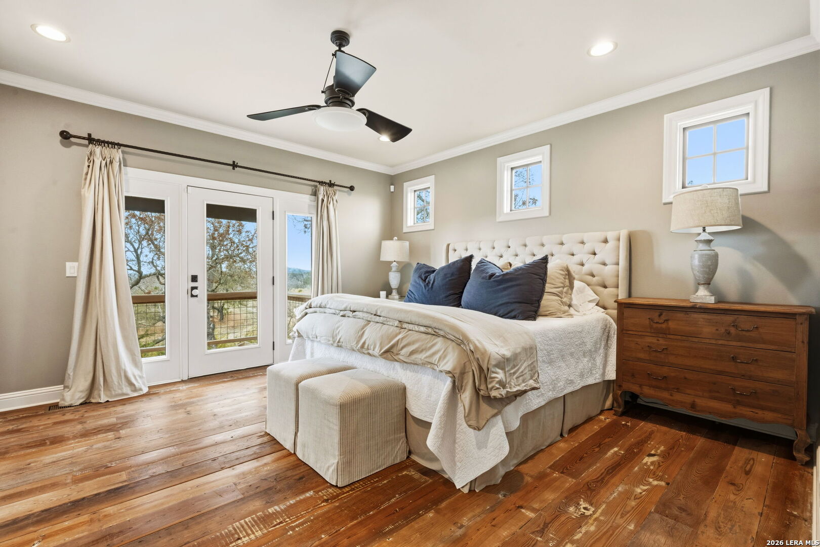 1429 Kendall Jackson Comfort, TX 78013 - Photo 26 of 88 a spacious bedroom with a bed a couch and a large window