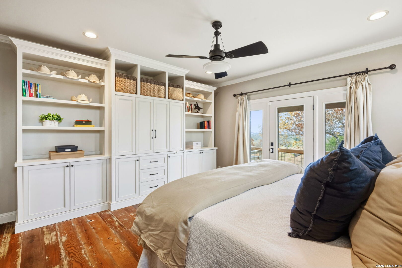 1429 Kendall Jackson Comfort, TX 78013 - Photo 27 of 88 a spacious bedroom with a large bed a chandelier and a window