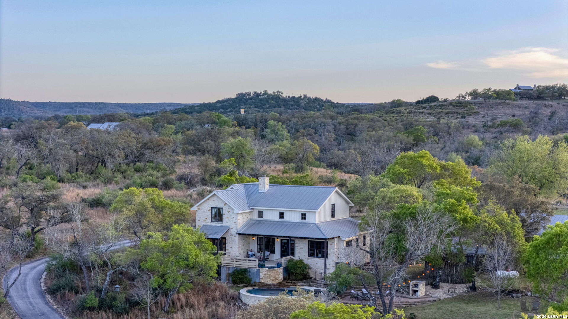 1429 Kendall Jackson Comfort, TX 78013 - Photo 59 of 88 an aerial view of a house with a big yard and large trees