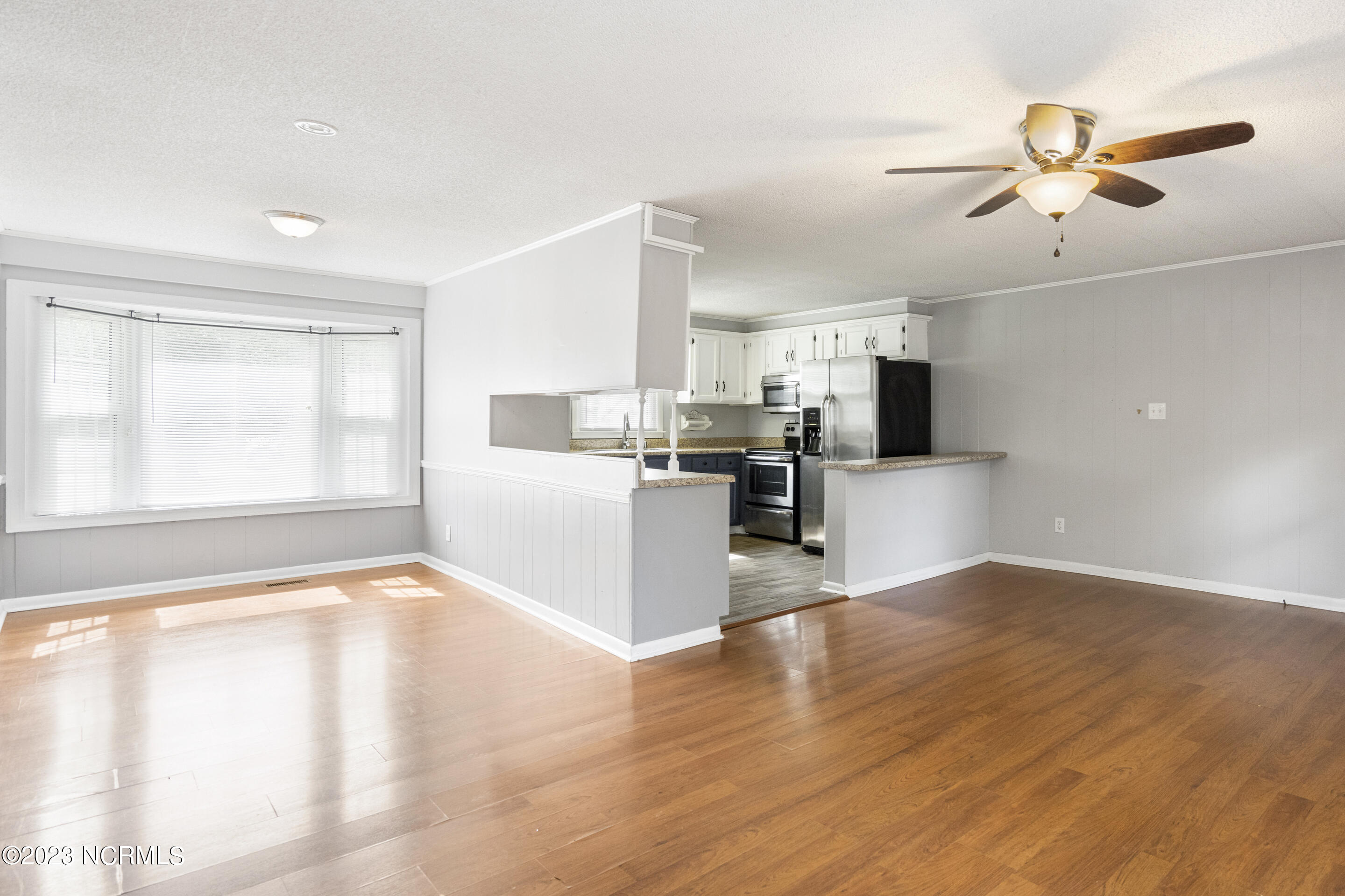 2894 Dawson Cabin Road Jacksonville, NC 28540 - Photo 13 of 32 Living Area, Dining, and Kitchen
