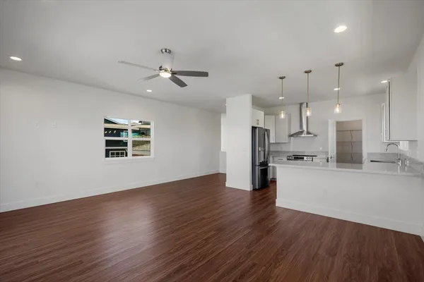 a kitchen with a white cabinets and stainless steel appliances