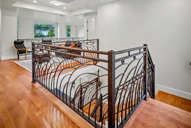 a view of entryway with a window and wooden floor