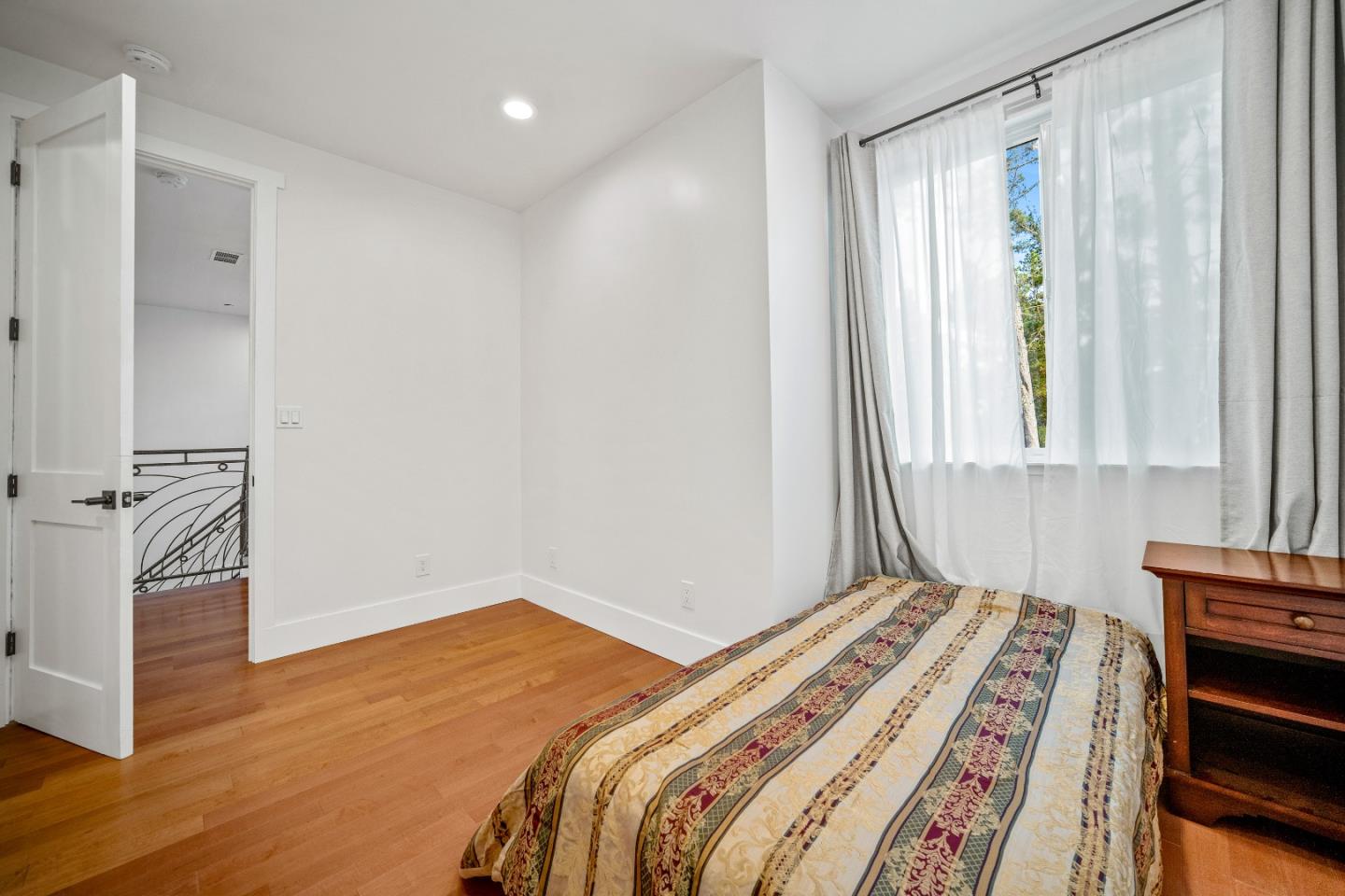 4044 Sunset Lane Pebble Beach, CA 93953 - Photo 25 of 39 a bedroom with a bed and a window