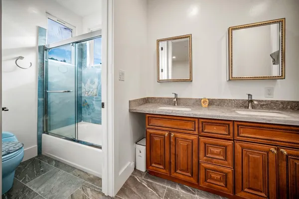 a bedroom with a bed and a view of bedroom