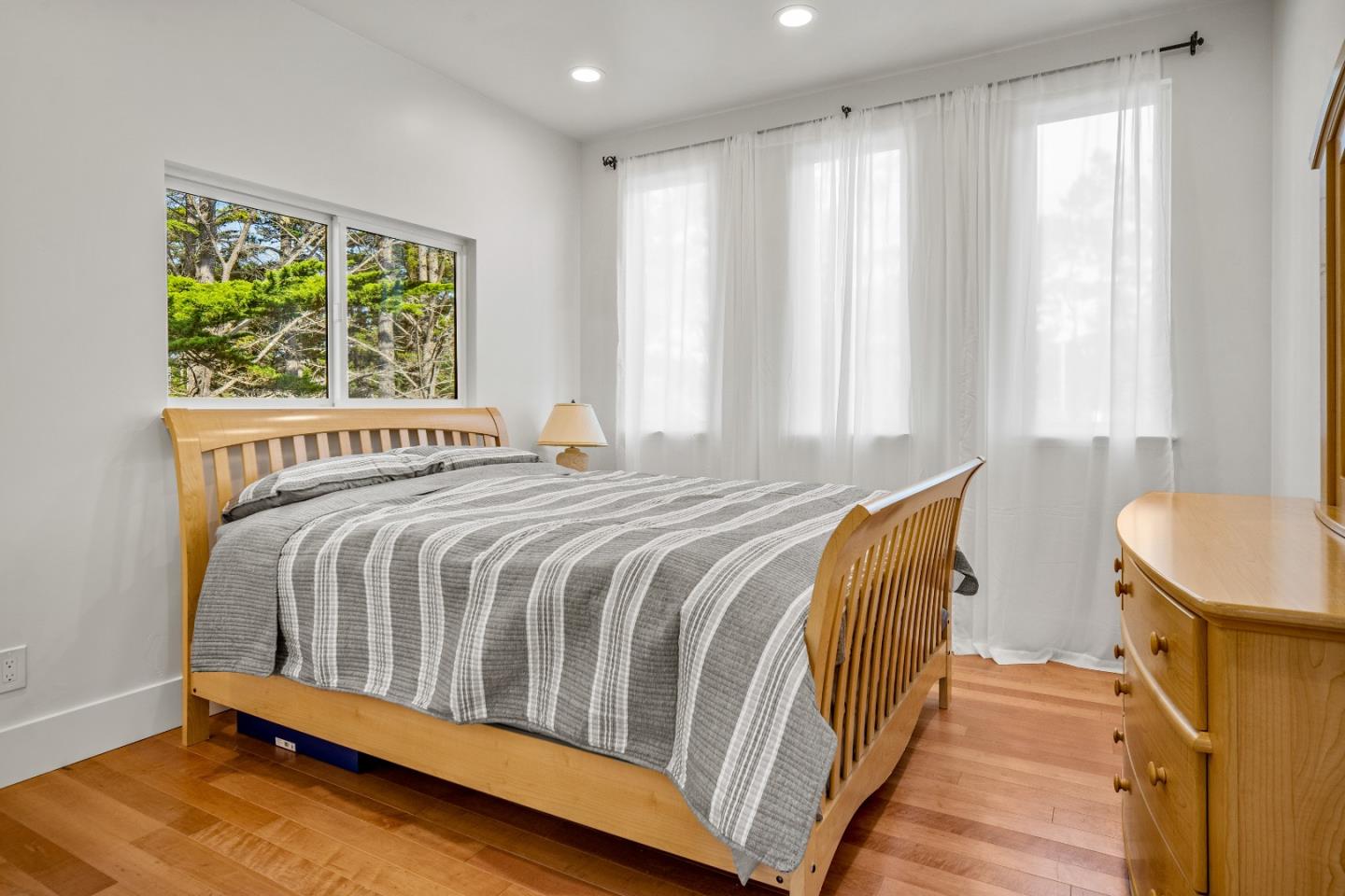 4044 Sunset Lane Pebble Beach, CA 93953 - Photo 28 of 39 a bedroom with a bed and a window