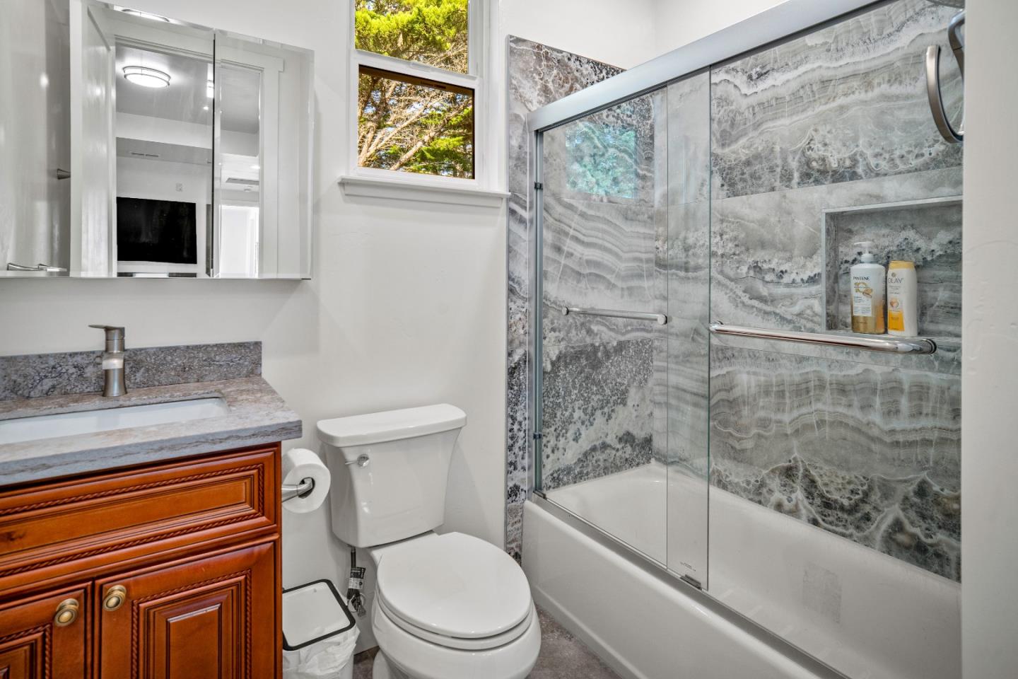 4044 Sunset Lane Pebble Beach, CA 93953 - Photo 29 of 39 a bathroom with a granite countertop sink toilet and shower
