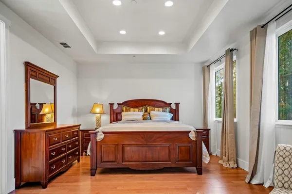a bedroom with furniture and a window