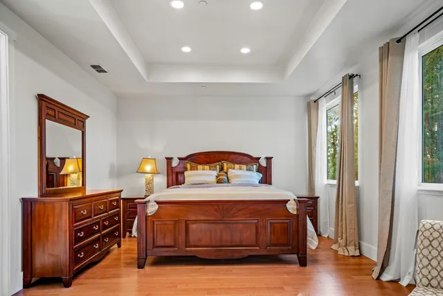 a bedroom with furniture and a window
