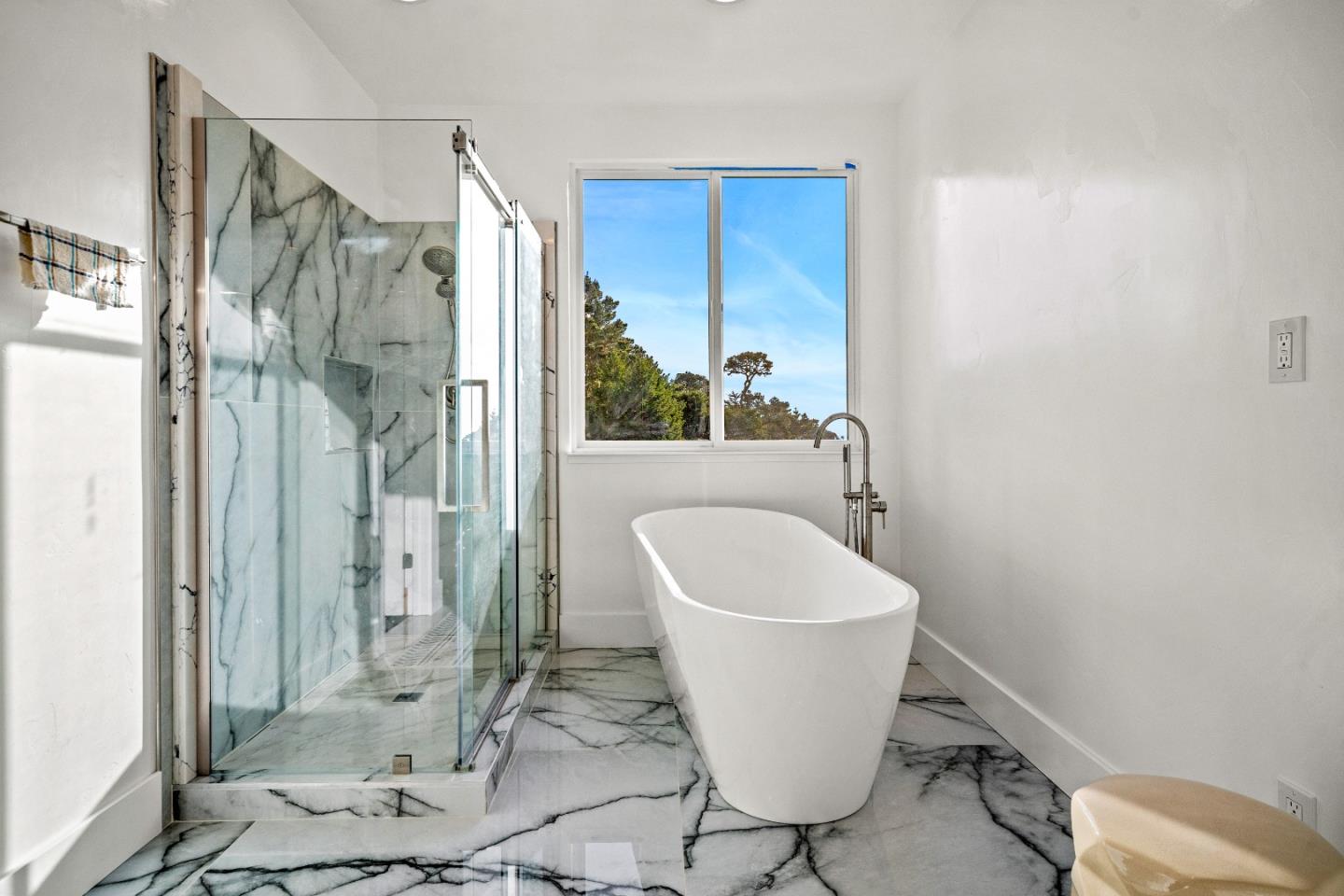 4044 Sunset Lane Pebble Beach, CA 93953 - Photo 33 of 39 a white bath tub sitting next to a white toilet