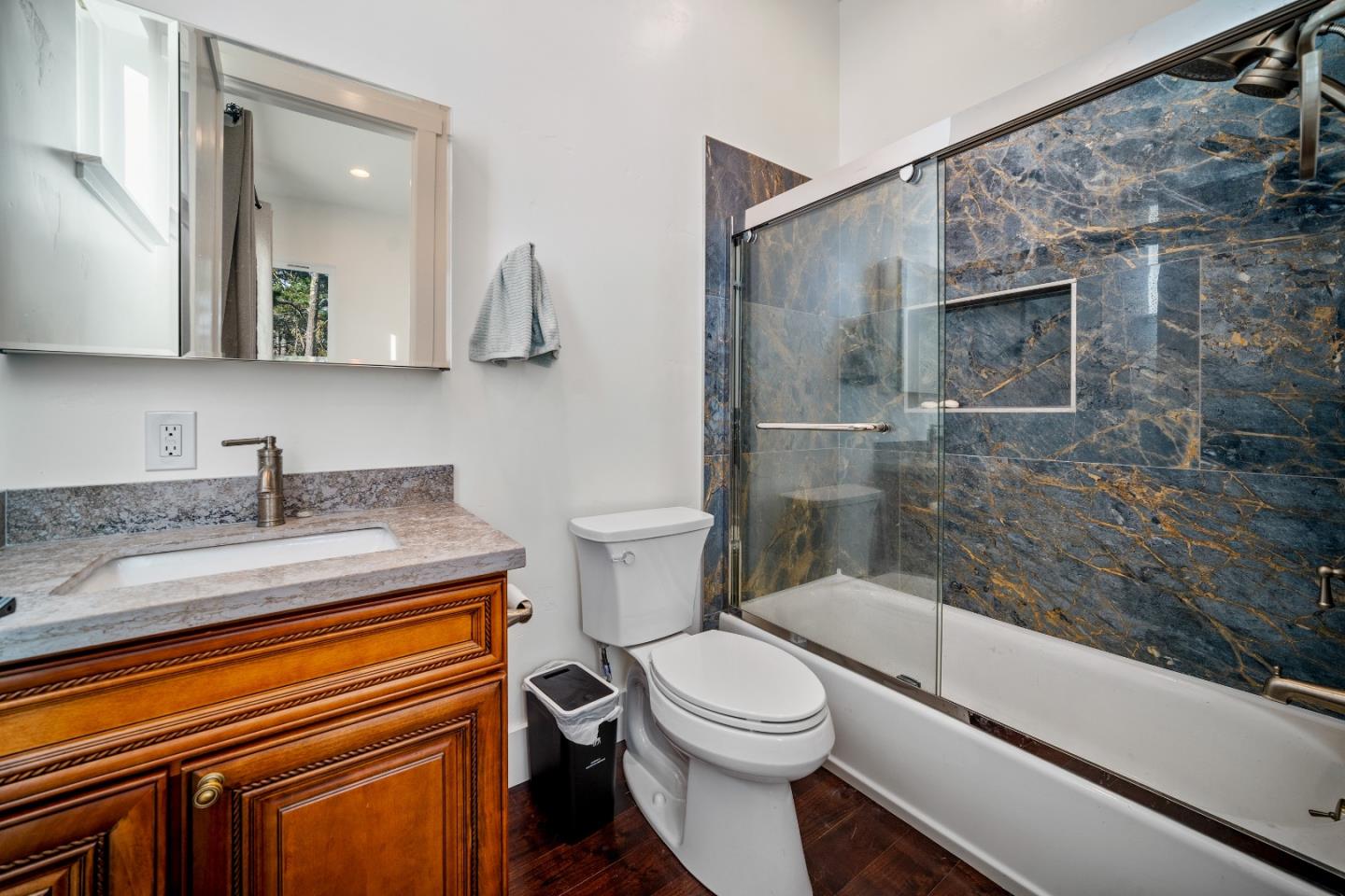 4044 Sunset Lane Pebble Beach, CA 93953 - Photo 36 of 39 a bathroom with a granite countertop sink toilet and shower