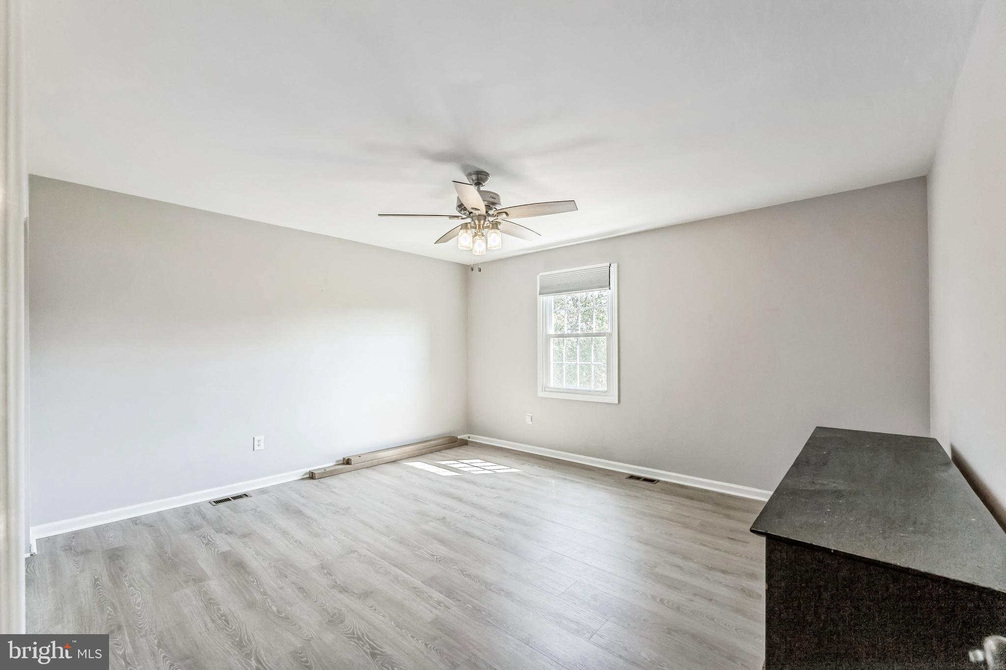 23 New Oak Road Mickleton, NJ 08056 - Photo 20 of 30 wooden floor in an empty room with a window