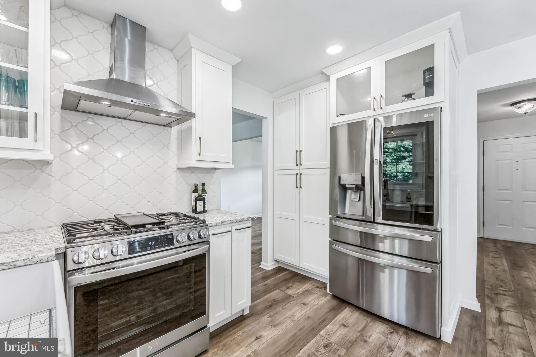 23 New Oak Road Mickleton, NJ 08056 - Photo 4 of 30 a kitchen with stainless steel appliances granite countertop a stove and a refrigerator
