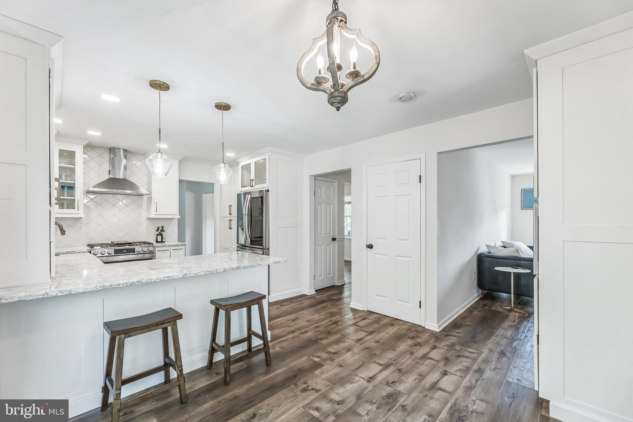 23 New Oak Road Mickleton, NJ 08056 - Photo 5 of 30 a large kitchen with a table and chairs