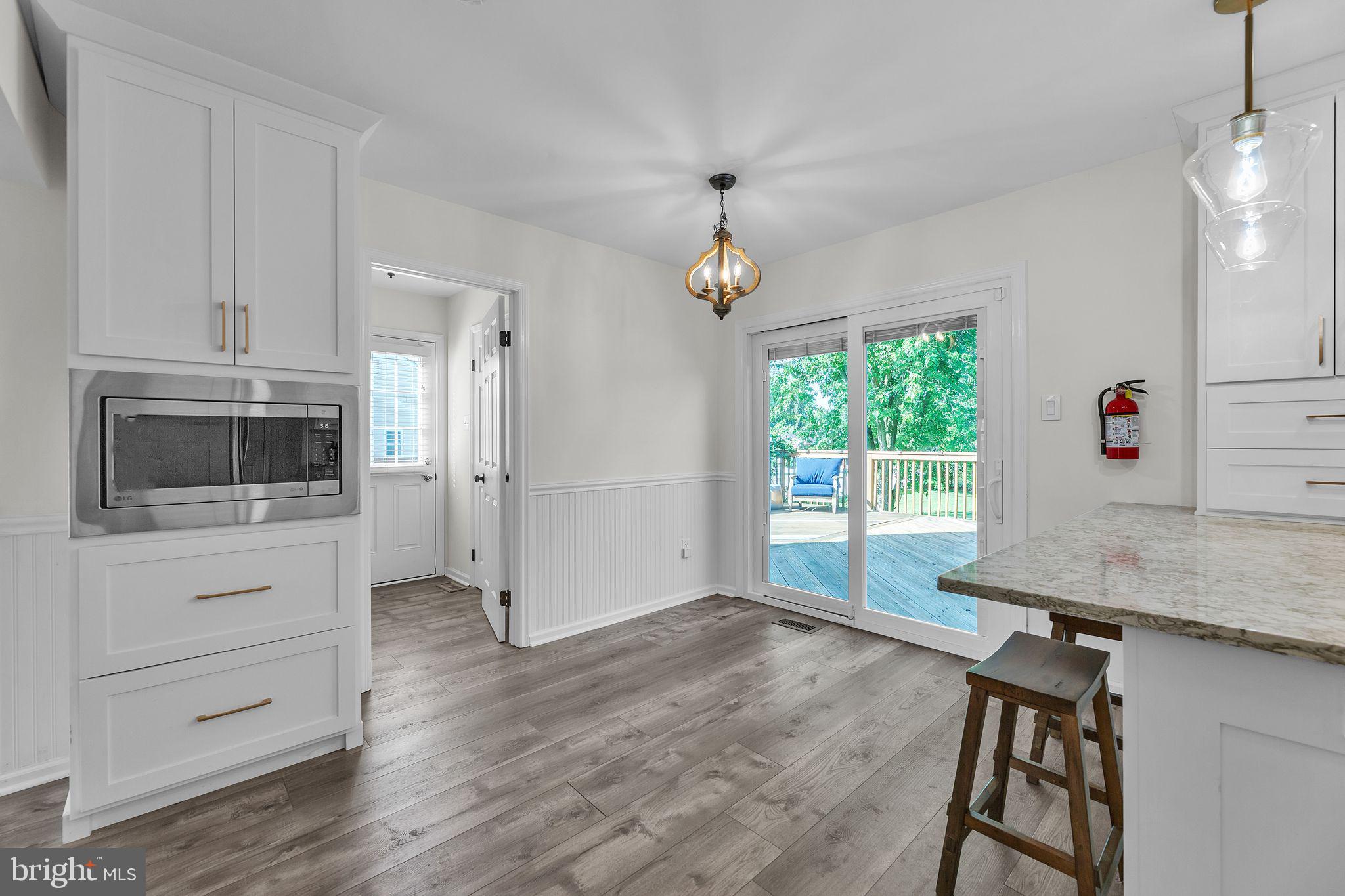 23 New Oak Road Mickleton, NJ 08056 - Photo 6 of 30 a kitchen with granite countertop a stove and a microwave