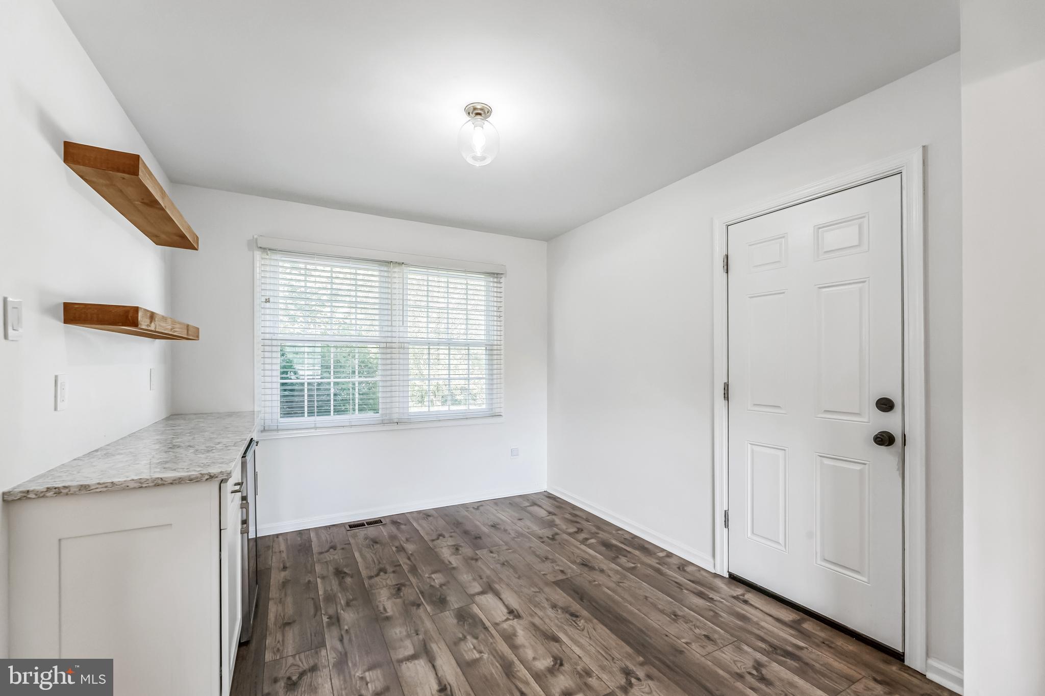 23 New Oak Road Mickleton, NJ 08056 - Photo 10 of 30 a view of an empty room with wooden floor and a window