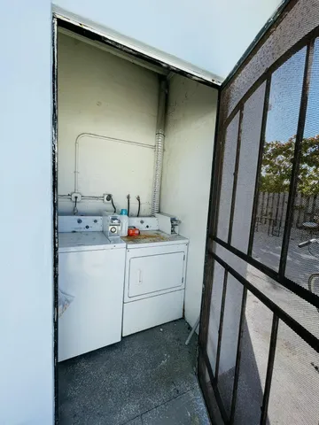 a view of a house with backyard and tree