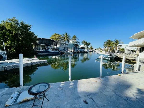 a view of swimming pool with outdoor seating