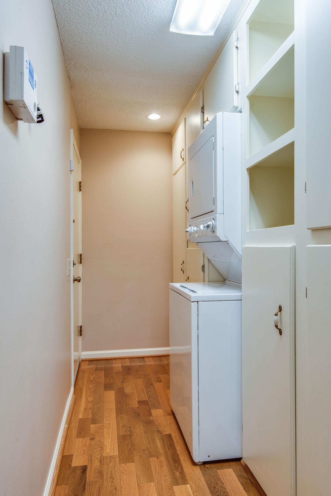 1444 Hunters Branch Road Antioch, TN 37013 - Photo 16 of 27 Cabinets and storage galore along with the full size washer and dryer that remains. This area leads to the garage.