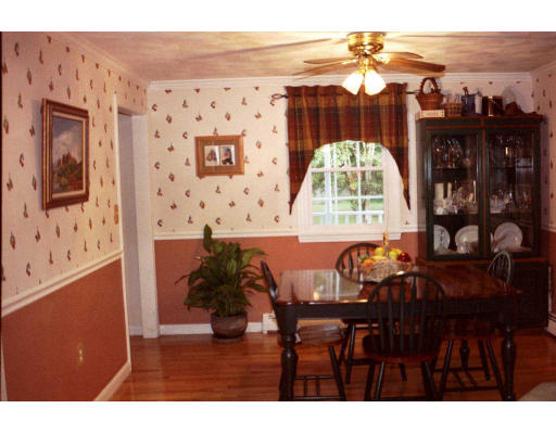 25 Springwell Road Billerica, MA 01821 - Photo 3 of 7 a view of a dining room with furniture and chandelier