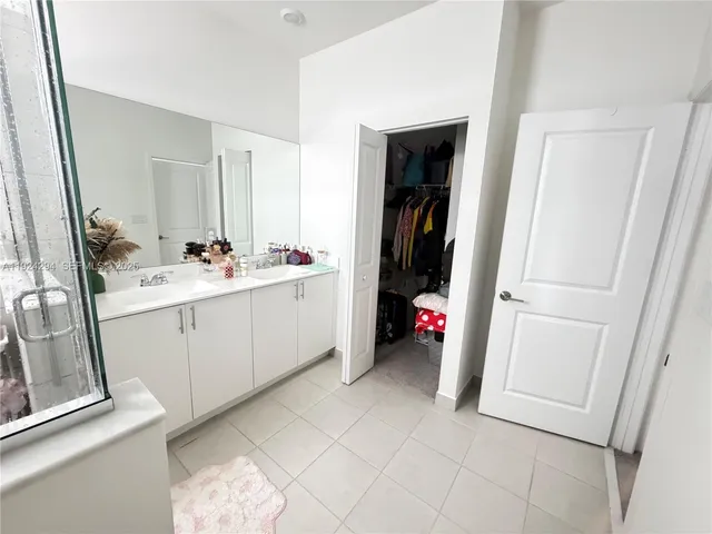 a view of utility room and bedroom