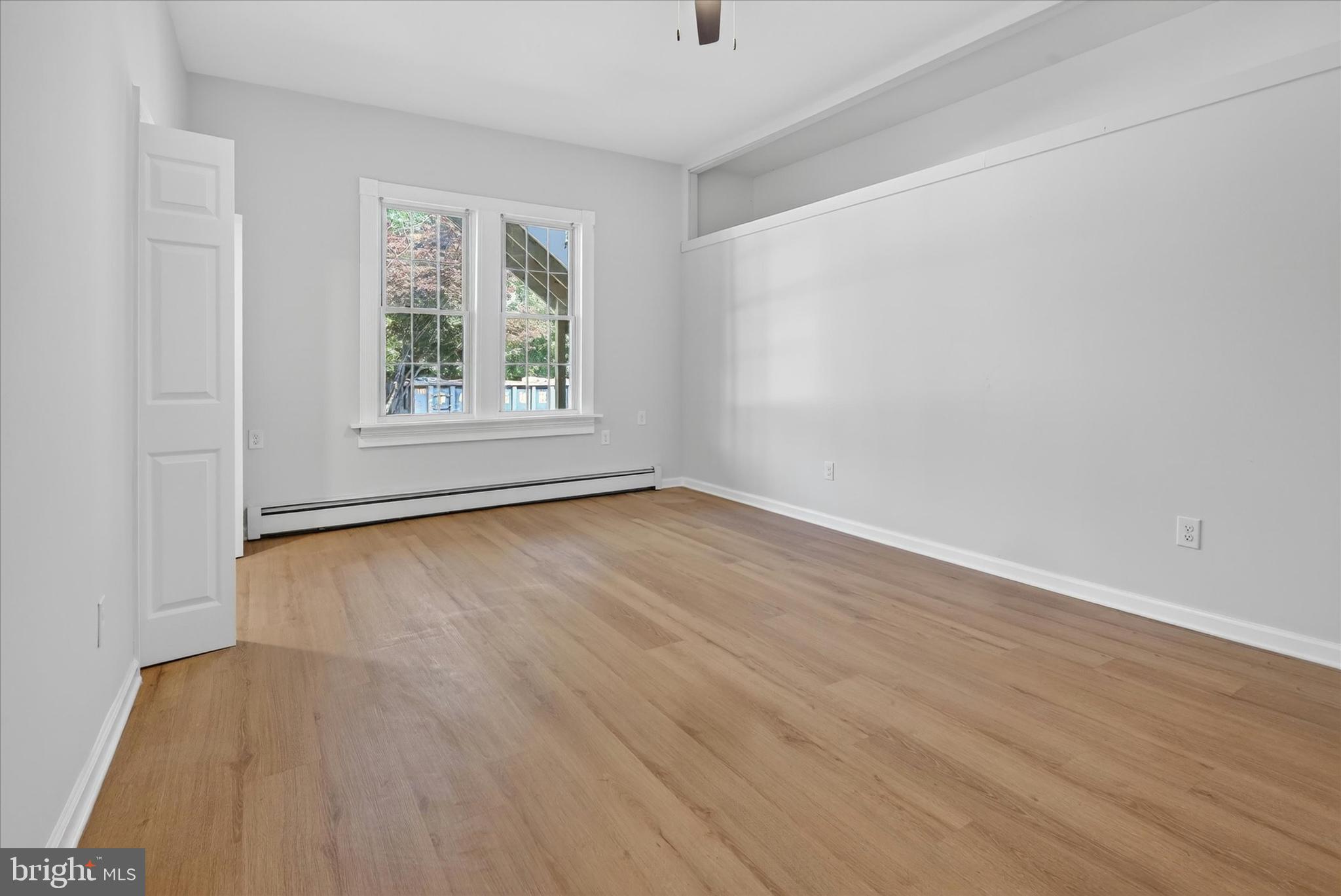 509 Lumberton Road, Unit 1 Hainesport, NJ 08036 - Photo 27 of 33 an empty room with wooden floor and windows