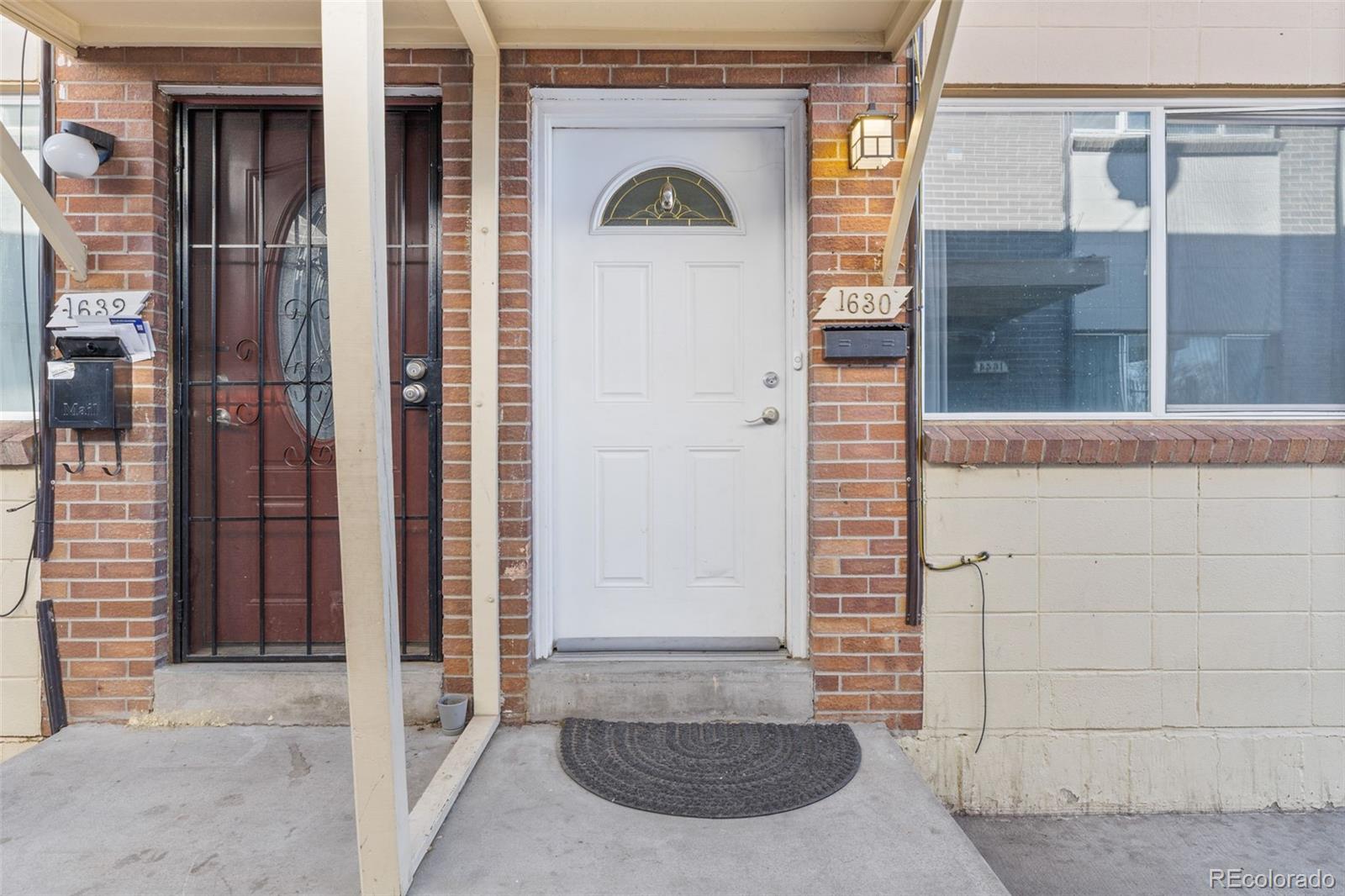 1630 Chester Street Aurora, CO 80010 - Photo 5 of 31 a view of entrance door of the house