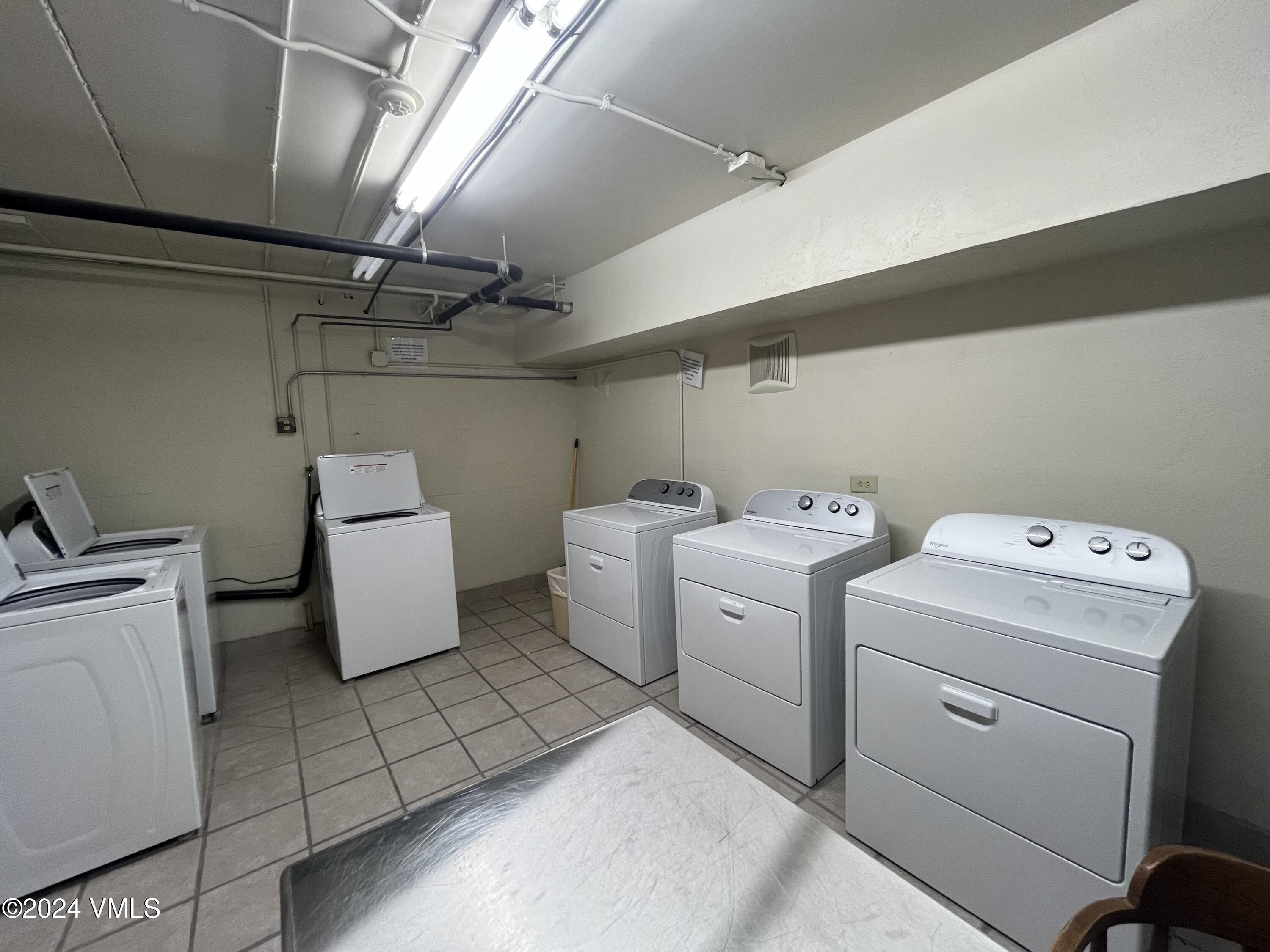 1020 Vail View Drive, Unit 110837 Vail, CO 81657 - Photo 10 of 21 a utility room with dryer and washer