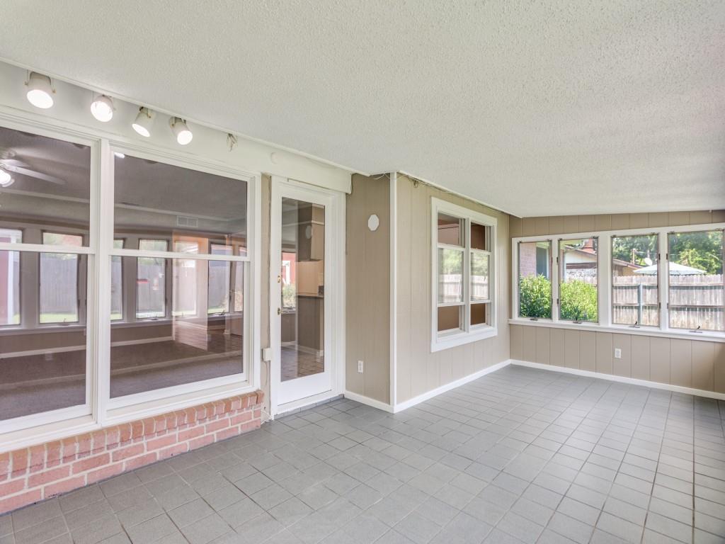 1216 Manning Street Benbrook, TX 76126 - Photo 19 of 26 Unfurnished sunroom with a textured ceiling and tile patterned floors