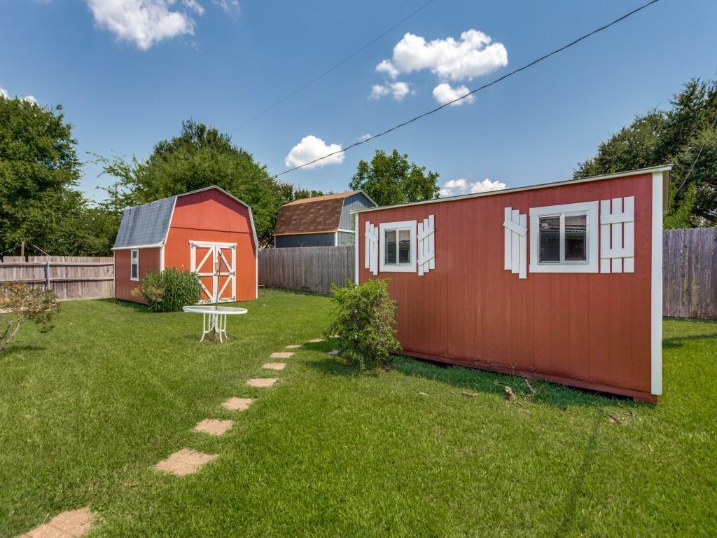 1216 Manning Street Benbrook, TX 76126 - Photo 22 of 26 Fenced backyard with a storage unit