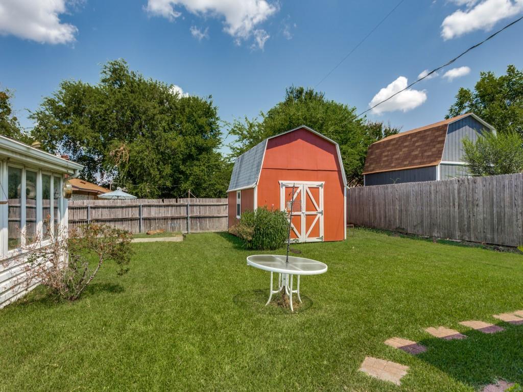 1216 Manning Street Benbrook, TX 76126 - Photo 23 of 26 Fenced backyard featuring a storage shed