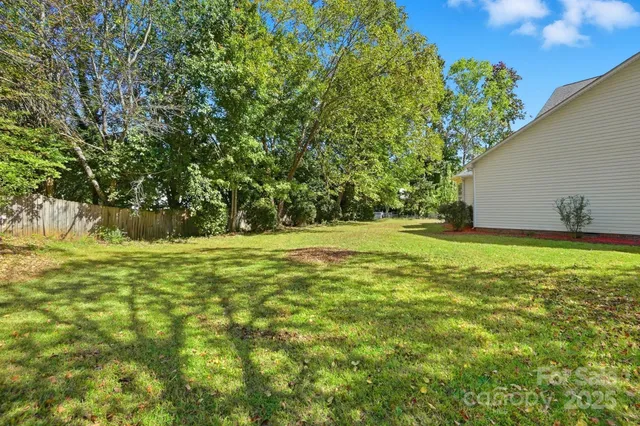 a view of outdoor space with deck and yard
