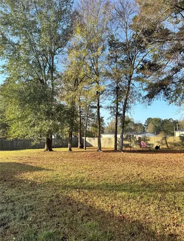 a large building with trees in front of it