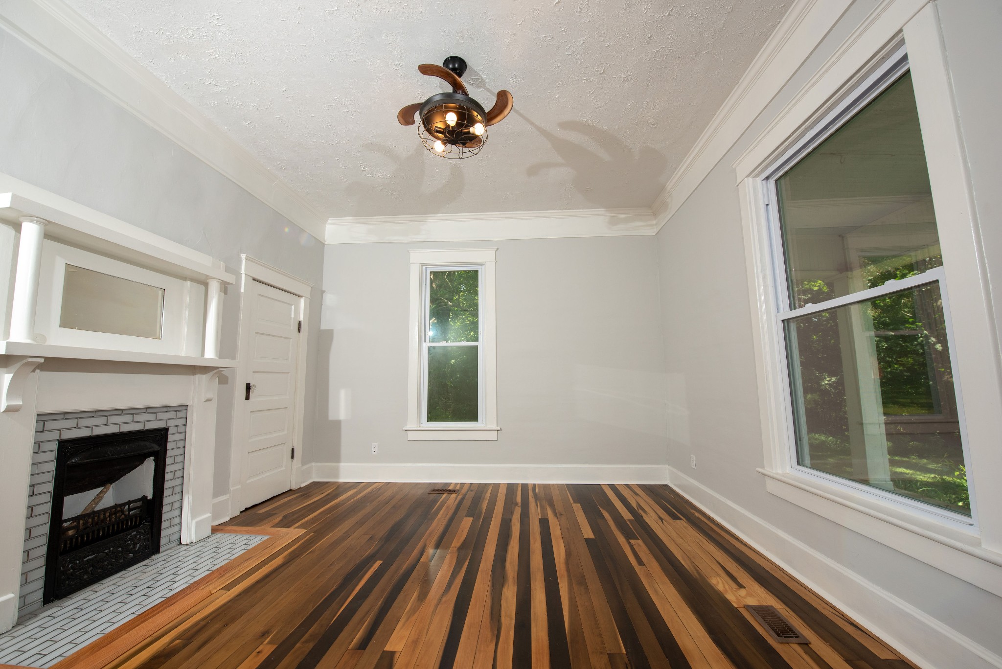 3058 Lipscomb Road Springfield, TN 37172 - Photo 8 of 19 a view of an empty room with wooden floor fireplace and a window